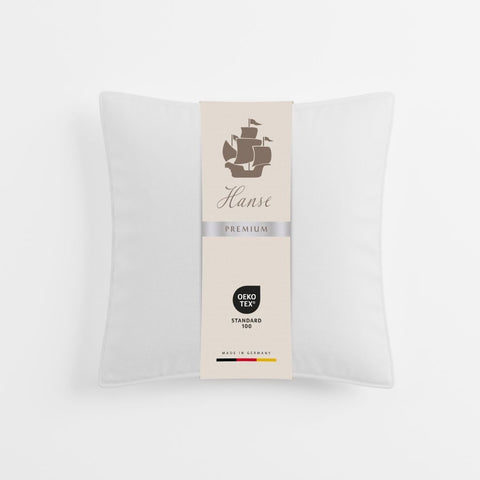 Verpacktes Premium Kopfkissen Natural Hybrid mit Qualitätslabel und hochwertigem Design für den Premium-Schlafbereich.