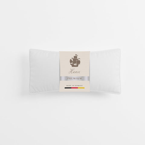 Premium Kopfkissen Natural Hybrid in Originalverpackung mit eleganter Produktbanderole und hochwertiger Präsentation.